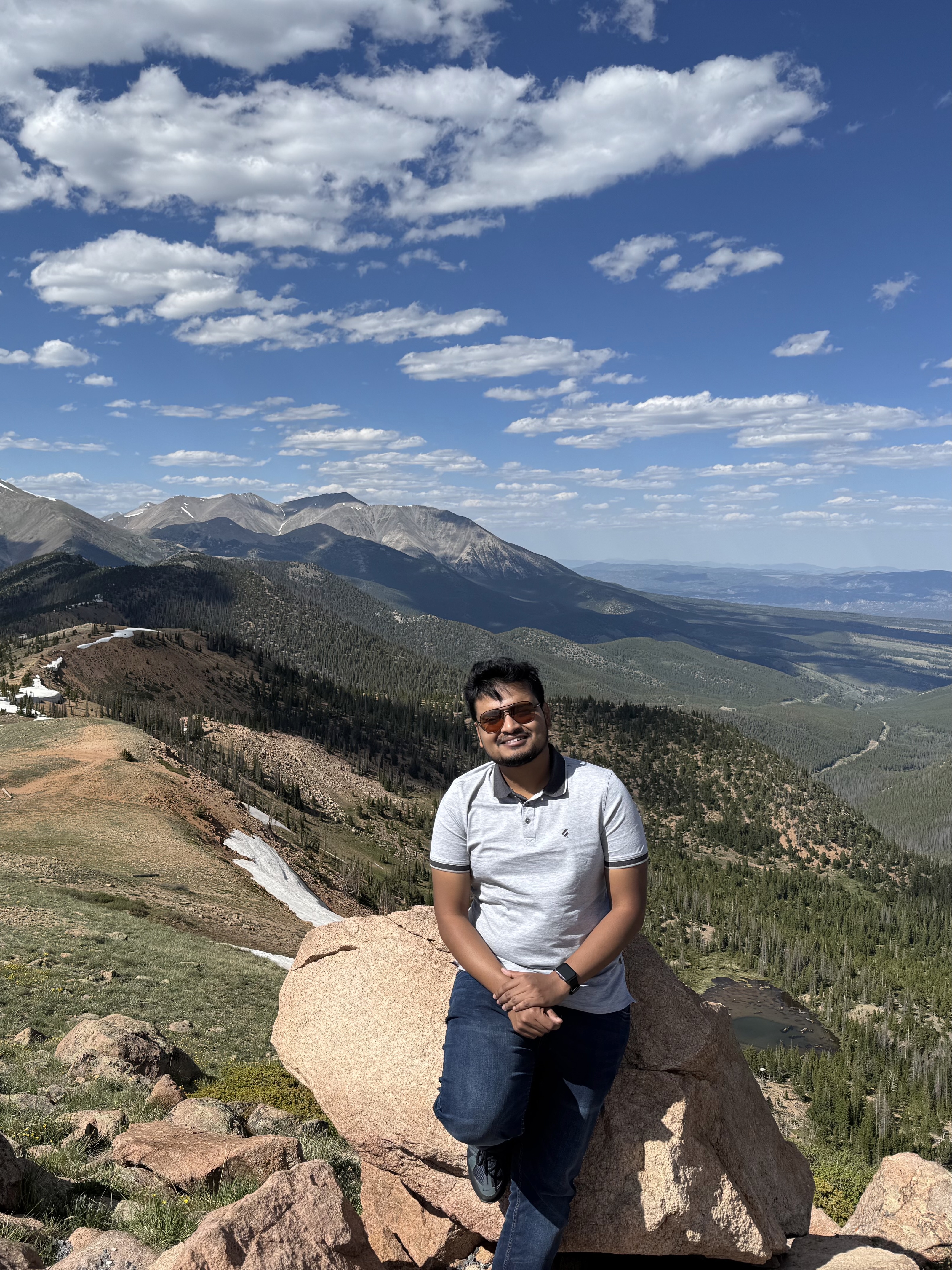 Tahmid Ul Islam seated at a mountain overlook in Colorado